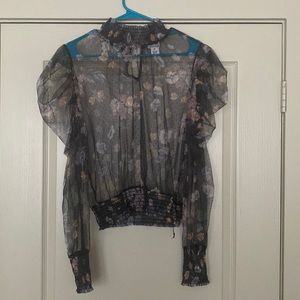 Sheer floral print blouse.